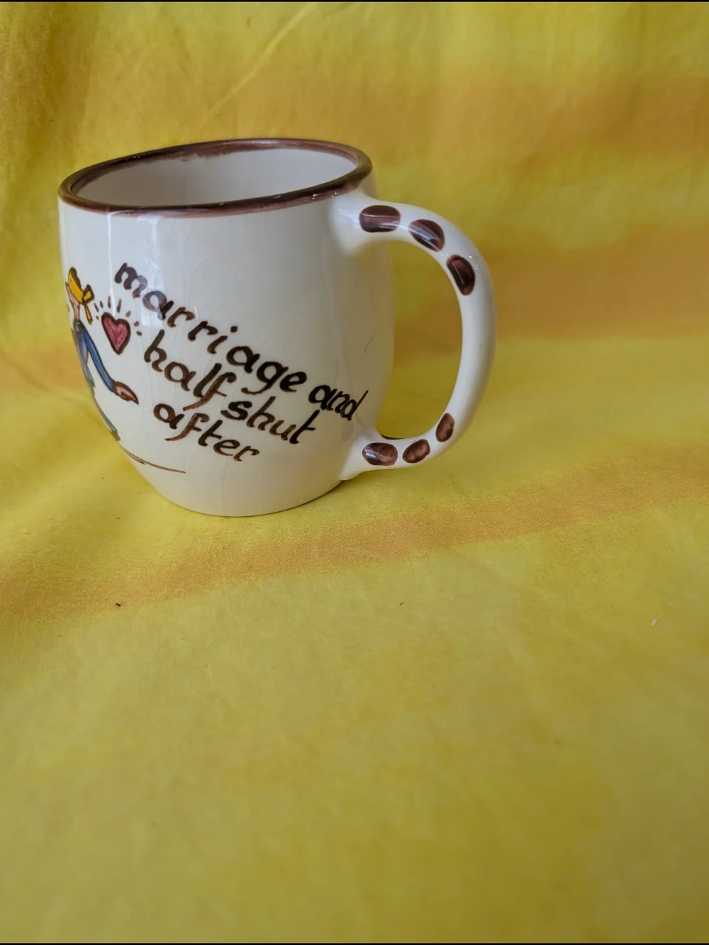 Hand-Painted Cream Ceramic Mug with Brown Trim and Colorful Illustration